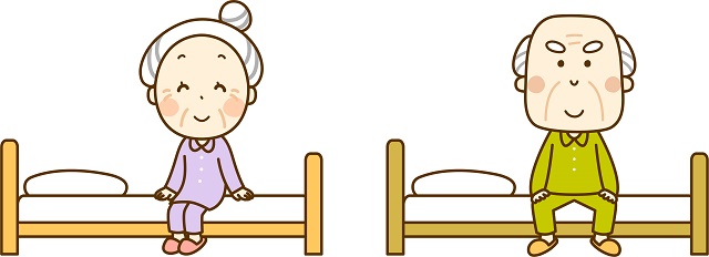 ベッドに腰かける高齢者